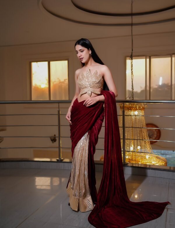 Regal Crimson Draped Saree with Golden Leaf Couture Blouse