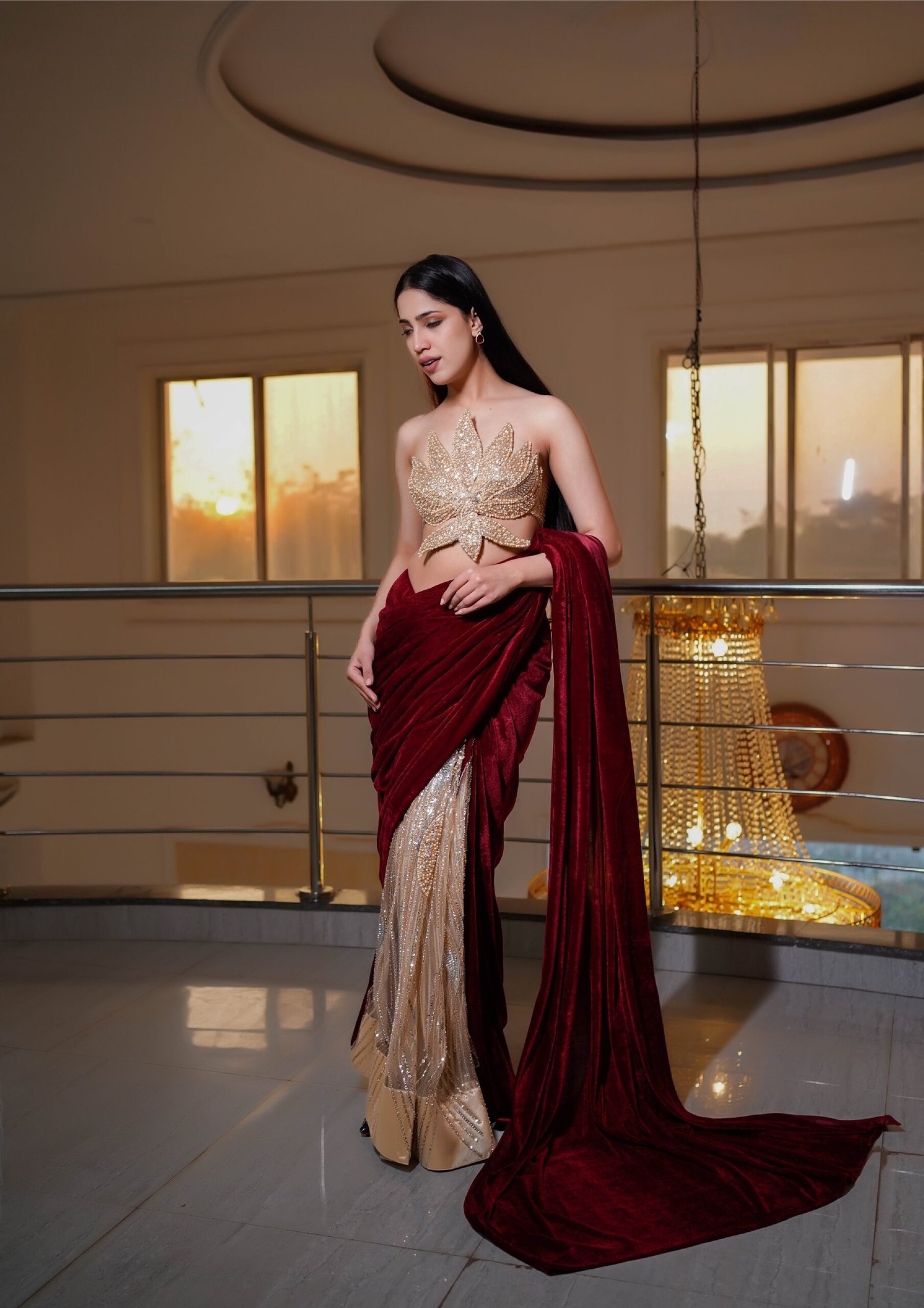 Regal Crimson Draped Saree with Golden Leaf Couture Blouse